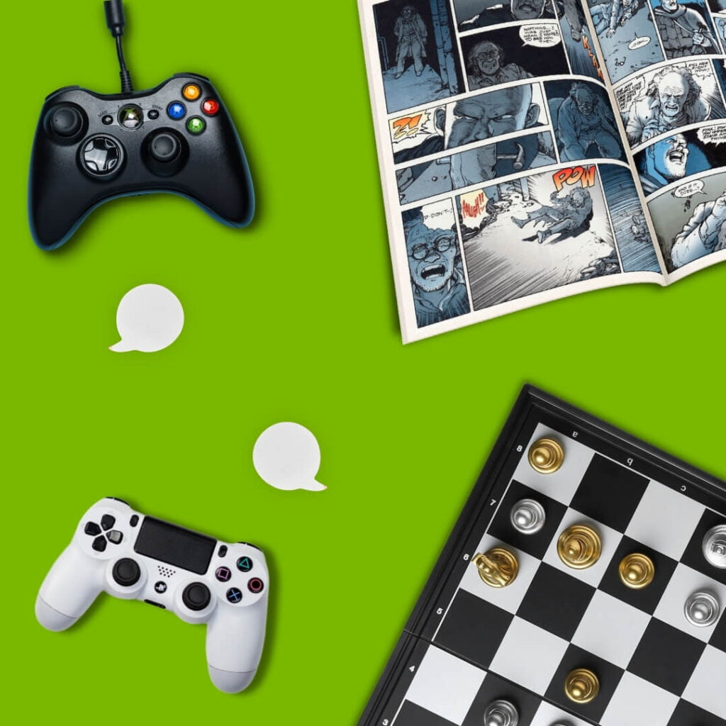 playstation controller , xbox controller, chess board and comic book